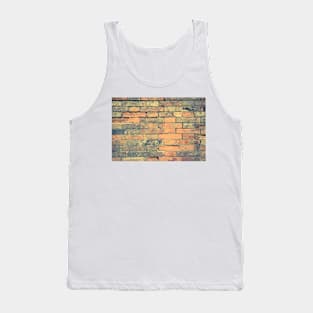 Old brick wall with cracks and scratches. Brick wall background. Distressed wall with broken bricks texture. House facade Tank Top